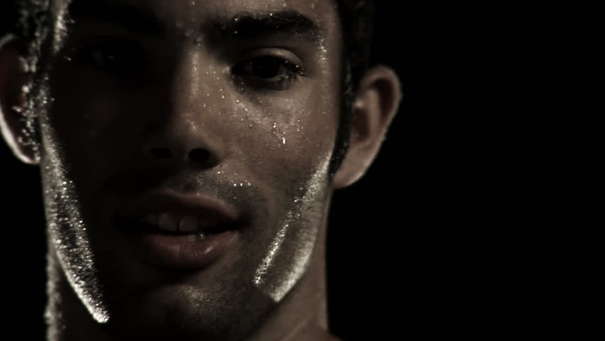 Male Athlete Gives An Intense Stare To The Camera Close Up Stock