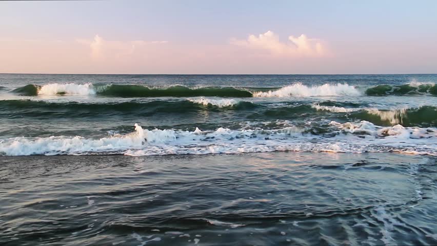 Loop Features Waves Breaking Beneath A Colorful Early Morning Sky With ...