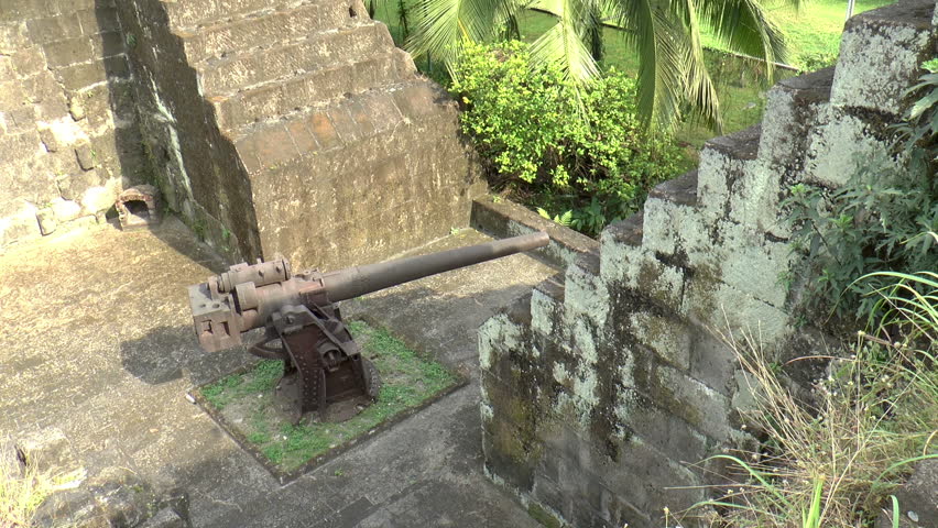 Zoom-out Shot Of Vintage Bombs And Cannon Displayed At Fort Santiago ...