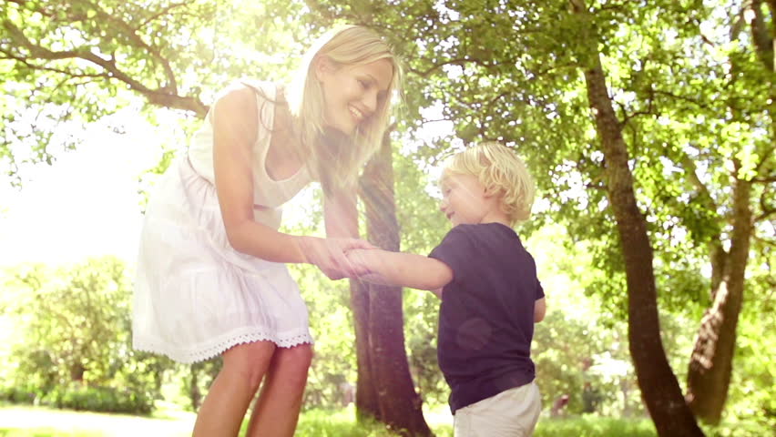 Mom And Son Dancing In Park In Slow Motion Stock Footage Video