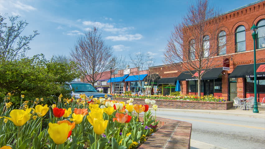 Vehicle Traffic Down Main Street In The Historic Downtown Of The City 