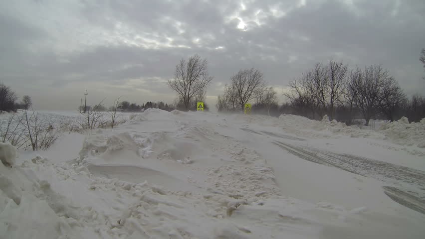 winter-storm-road-signs-covered-by-snow-heavy-snow-road-block-poor