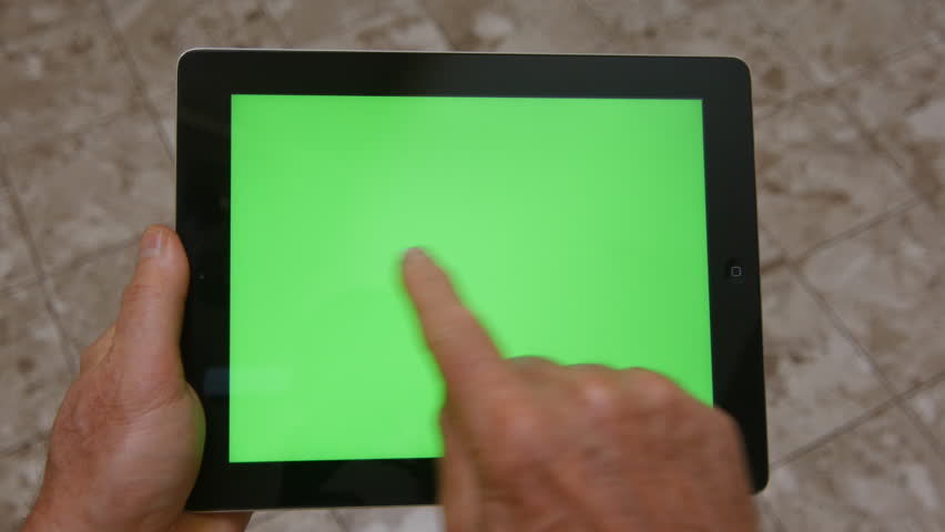 Los Angeles, CA.- Circa 2014. An IPad With Green-Screen Is Used By A