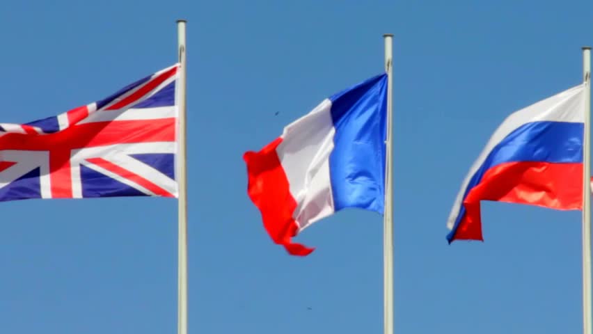 Flags Of Great Britain, France, Russia On Blue Sky Background Stock