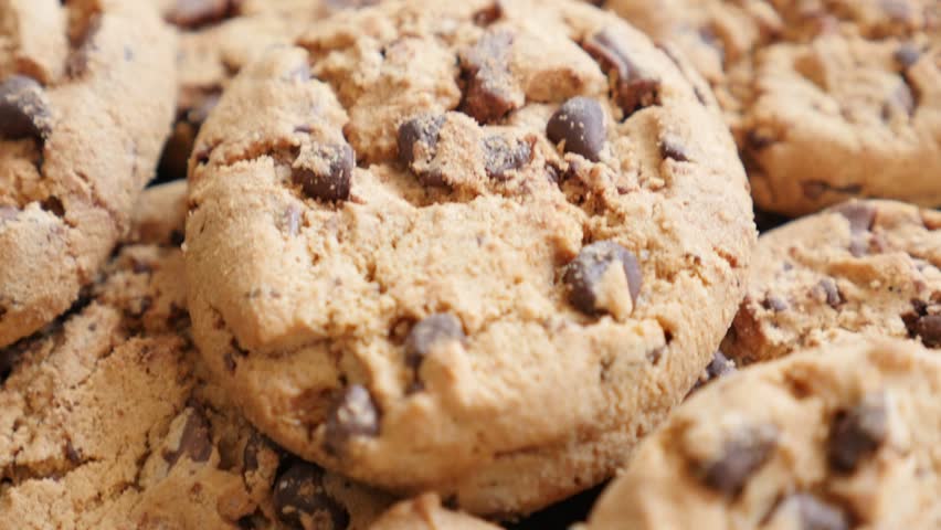 Closeup Of Cookie Crumbs Falling To White Floor In Front Of Businessman ...