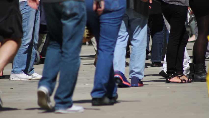 The Feet Of Dozens Of Pedestrians Walking On The Sidewalk In Chicago ...