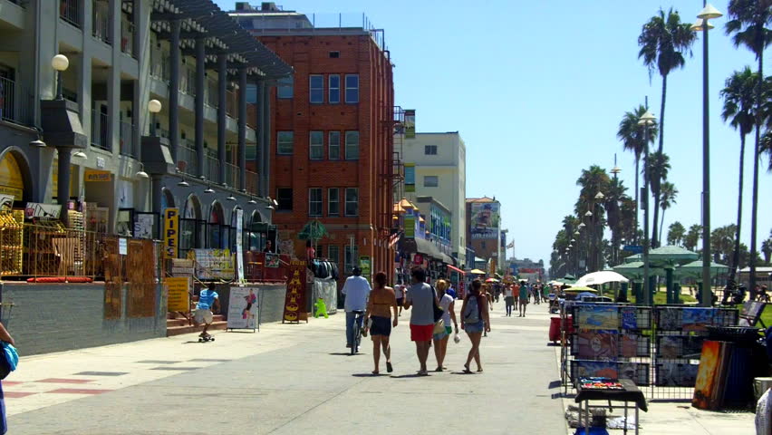 A Shot Looking Down The Venice Beach Boardwalk With Souvenir Shops ...