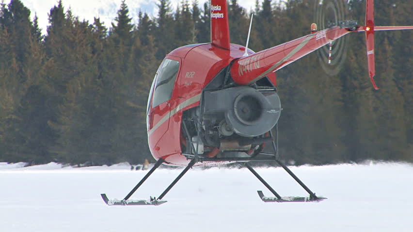 HOMER, AK CIRCA 2012: Red 2-man Helicopter (Robinson R22) Hovers Over ...