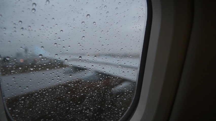 Rainy Jet Window. Taxiing. Looking Through Window Of A Moving ...