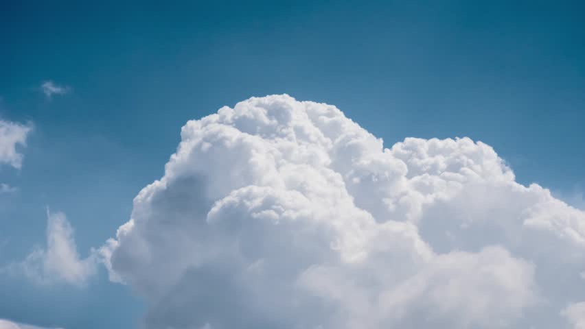 Dramatic White Cumulus Clouds Rolling Over Blue Sky Background. 4K UHD ...